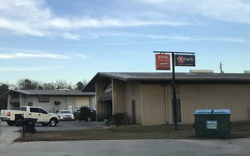 STIHL Chain Saws and eXmark dealer signs outside the Wilson Saw shop
